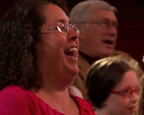 Audience member laughing.